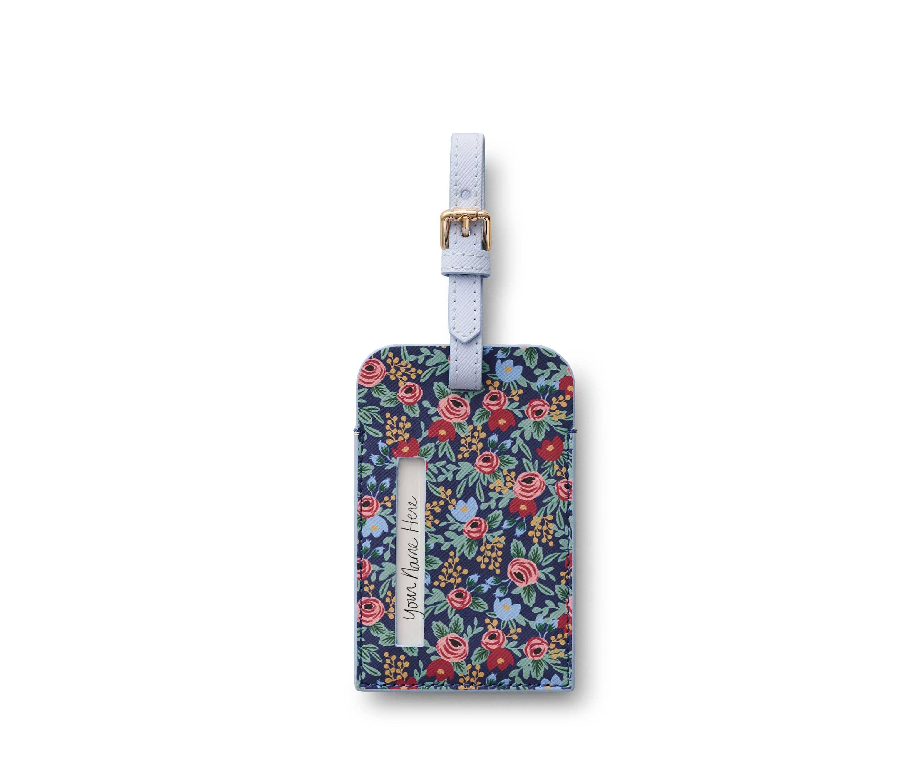 Floral-patterned luggage tag with a strap on a white background