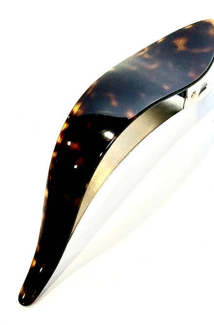 Tortoiseshell hair clip on a white background
