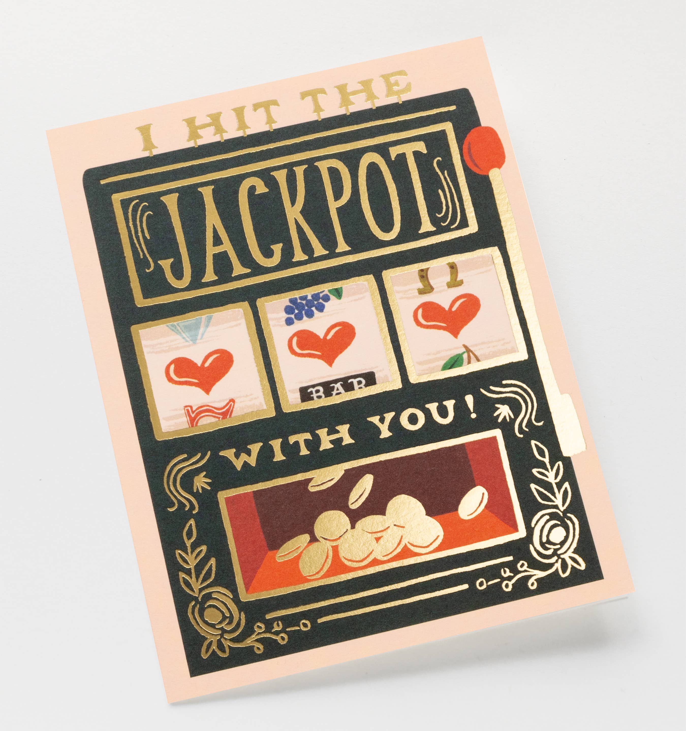 Greeting card with slot machine design and text 'I hit the jackpots with you!' on a light gray background