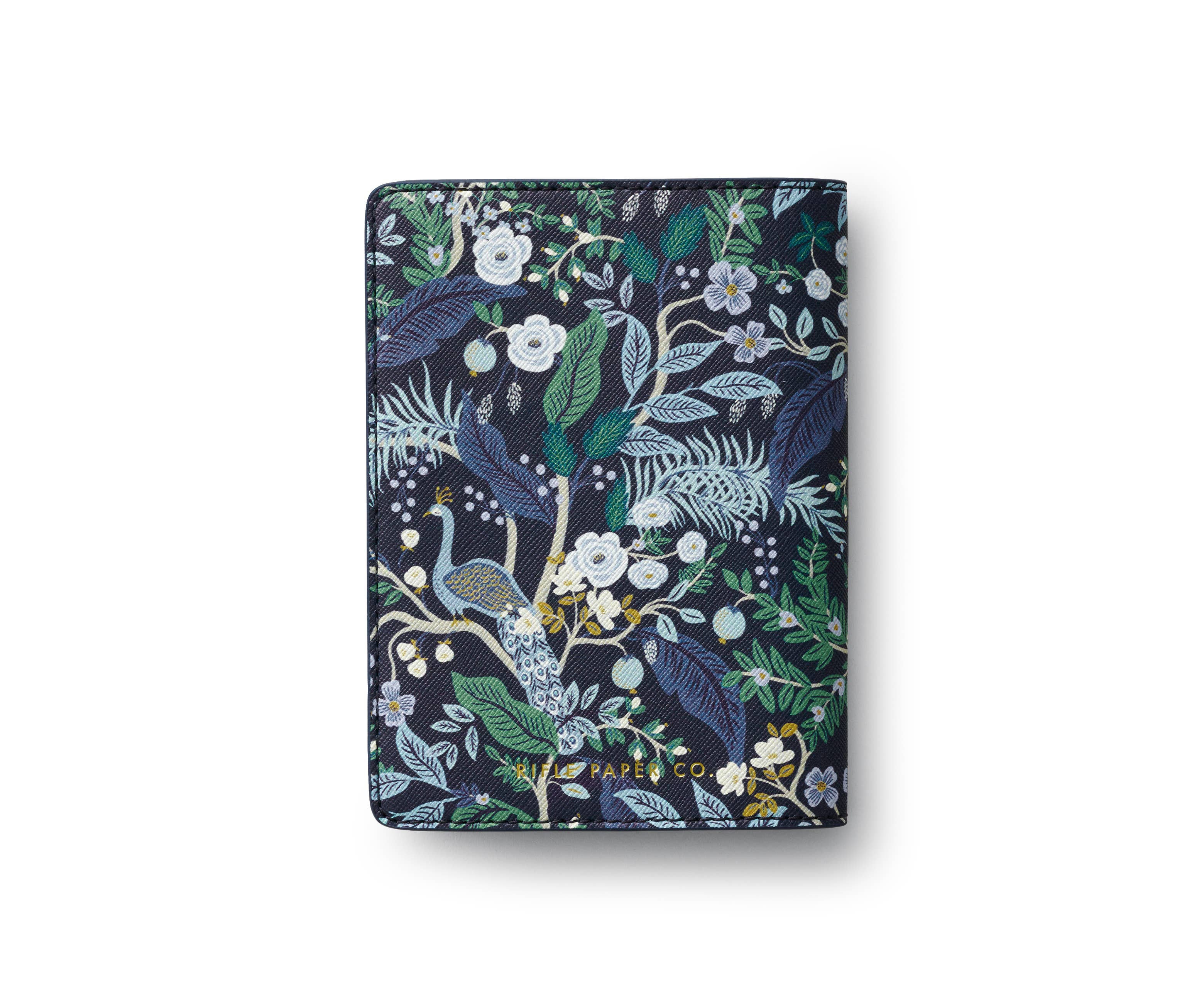 Floral and peacock patterned notebook on a white background