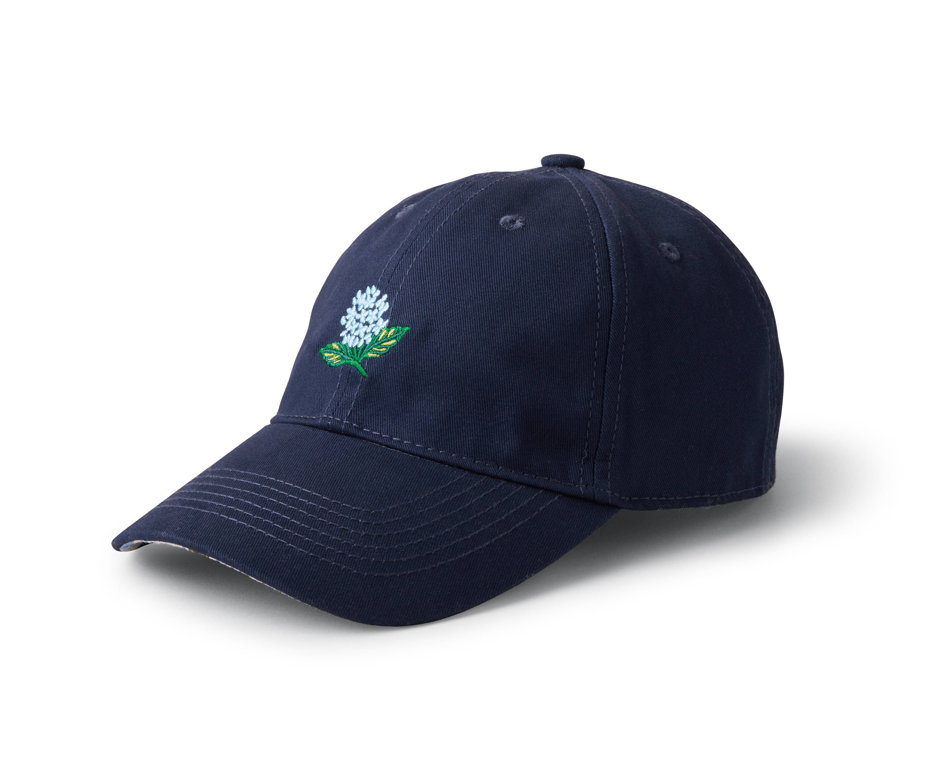 Navy blue cap with a floral emblem on a white background