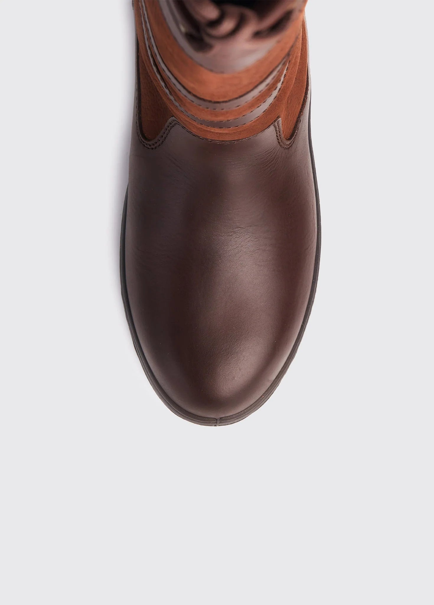 Brown leather boot with a white background