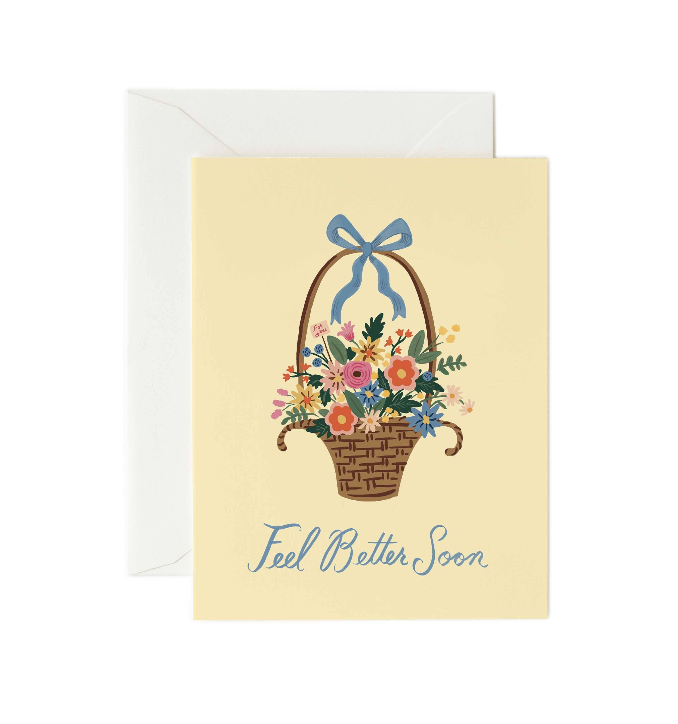 Greeting card with a floral basket and 'Feel Better Soon' text on a beige background.