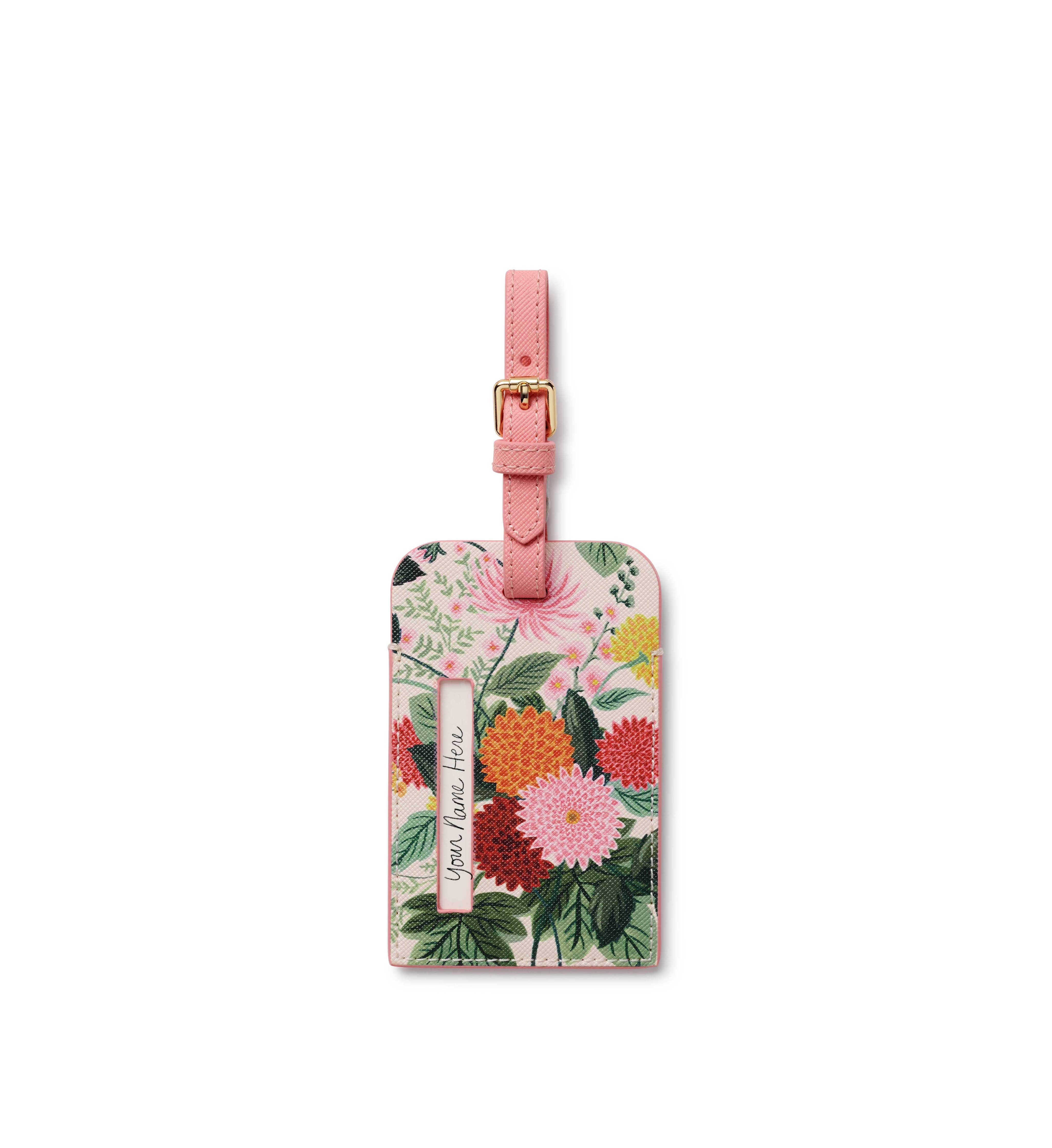 Floral luggage tag with pink strap on a white background