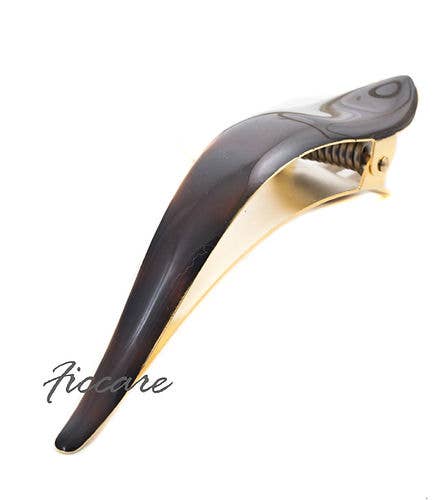 Black and gold guitar capo on a white background with 'Piccare' branding.