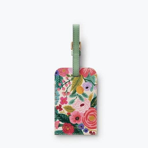 Floral-patterned luggage tag with a green strap on a white background