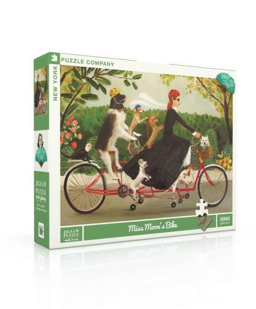 Jigsaw puzzle box with illustration of a woman on a tandem bicycle with dogs, featuring the New York Puzzle Company branding.