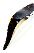 Tortoiseshell hair clip on a white background