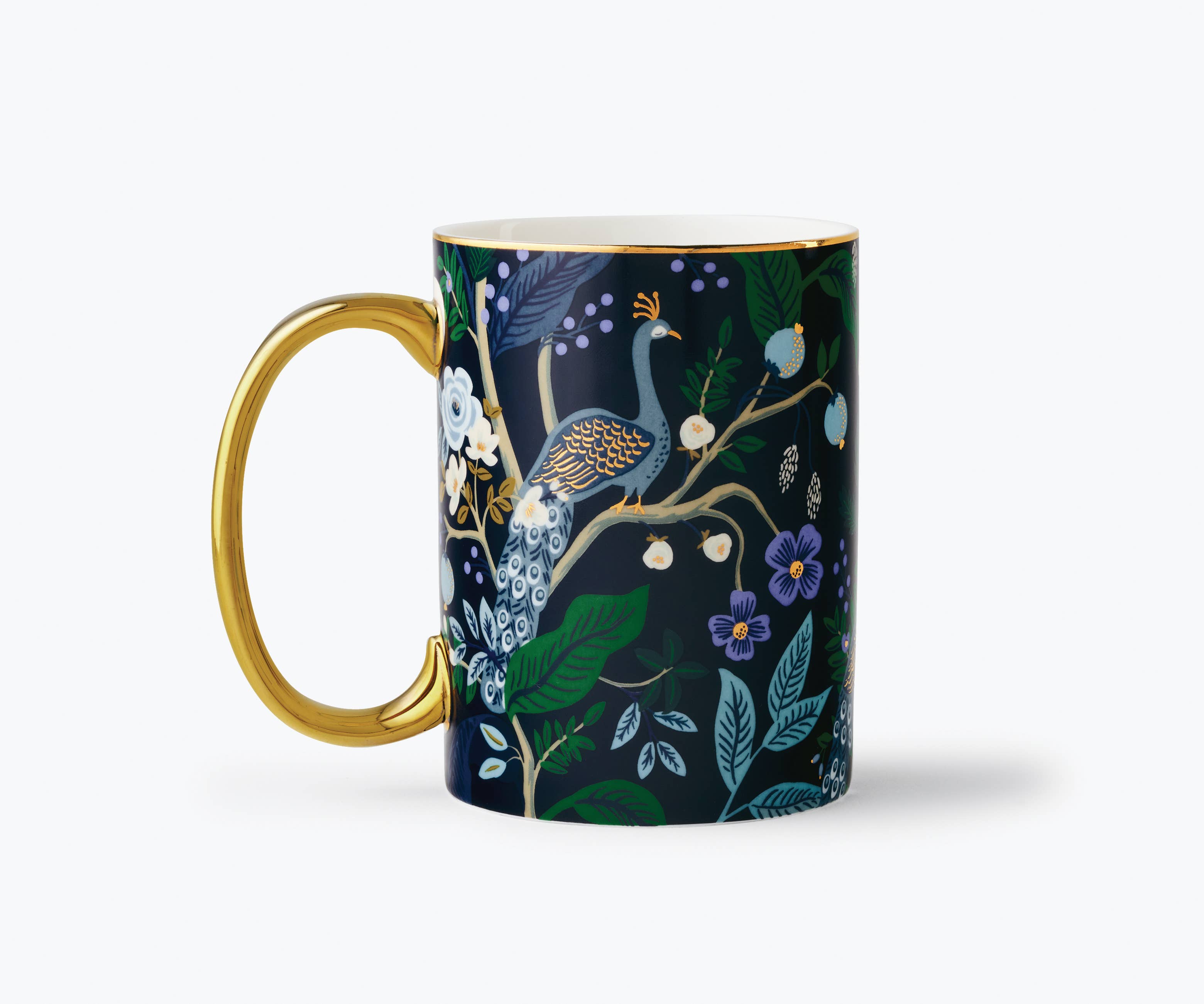 Mug with gold handle featuring a nature-themed design on a white background