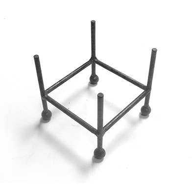 Black metal coaster stand on a white background