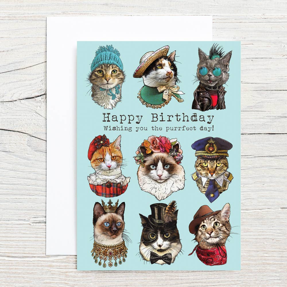 Birthday card with illustrated cats in costumes on a light blue background