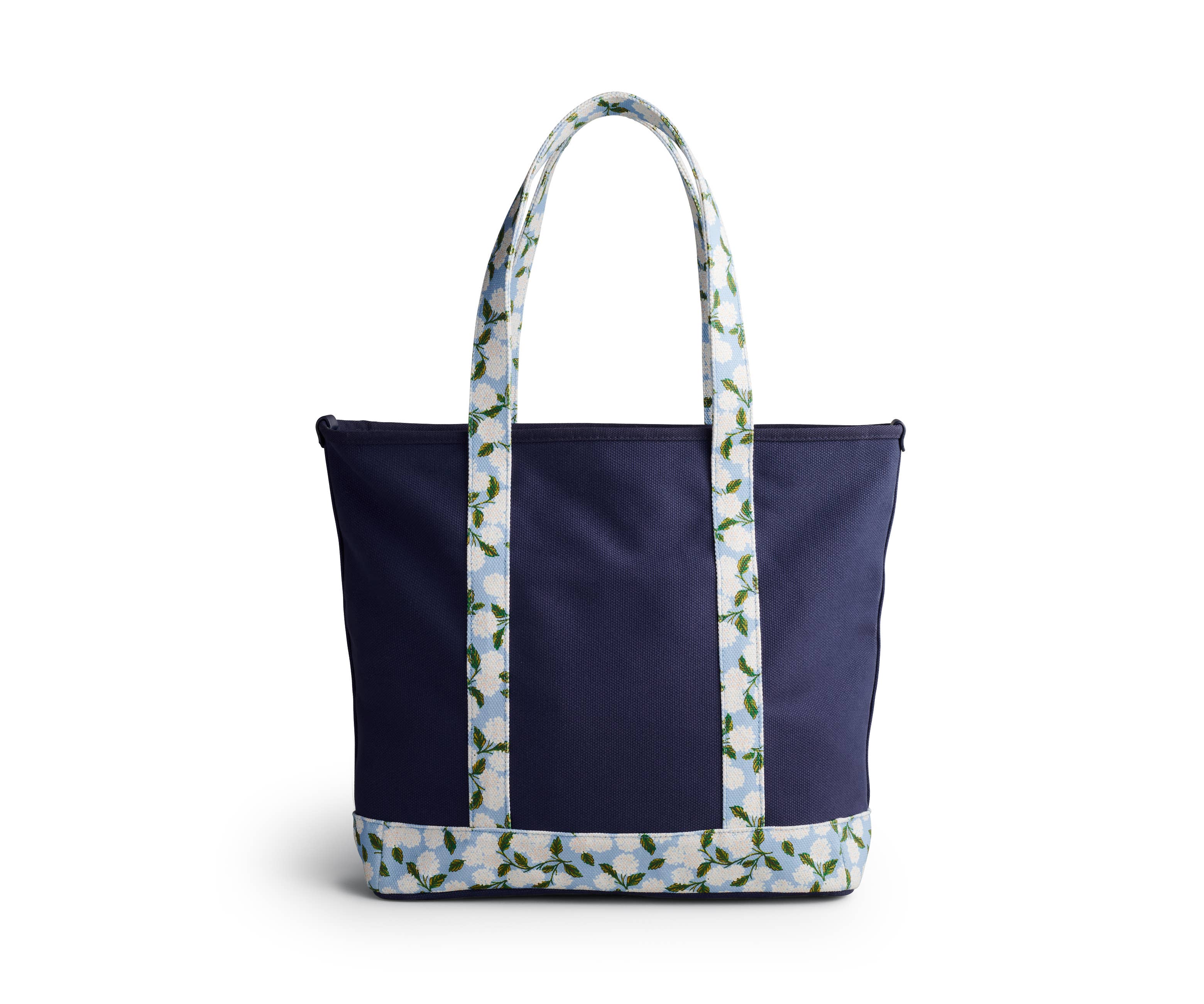 Navy tote bag with floral-patterned handle on a white background