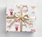 Gift box with decorative pattern and ribbon on a light gray background