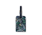 Luggage tag with floral and bird design on a white background