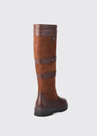 Brown knee-high boot with a strap on a light gray background