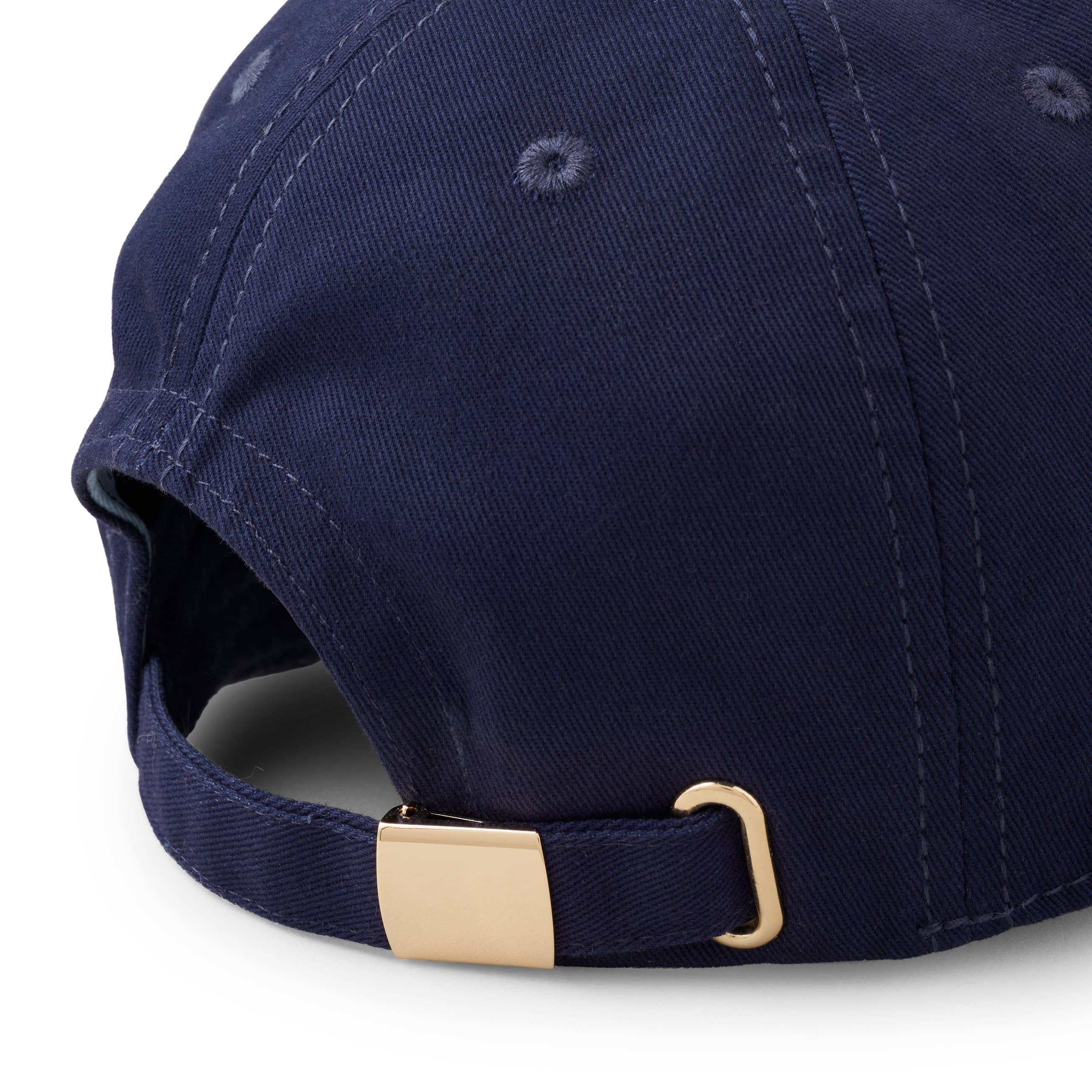 Navy blue cap with a gold buckle on a white background