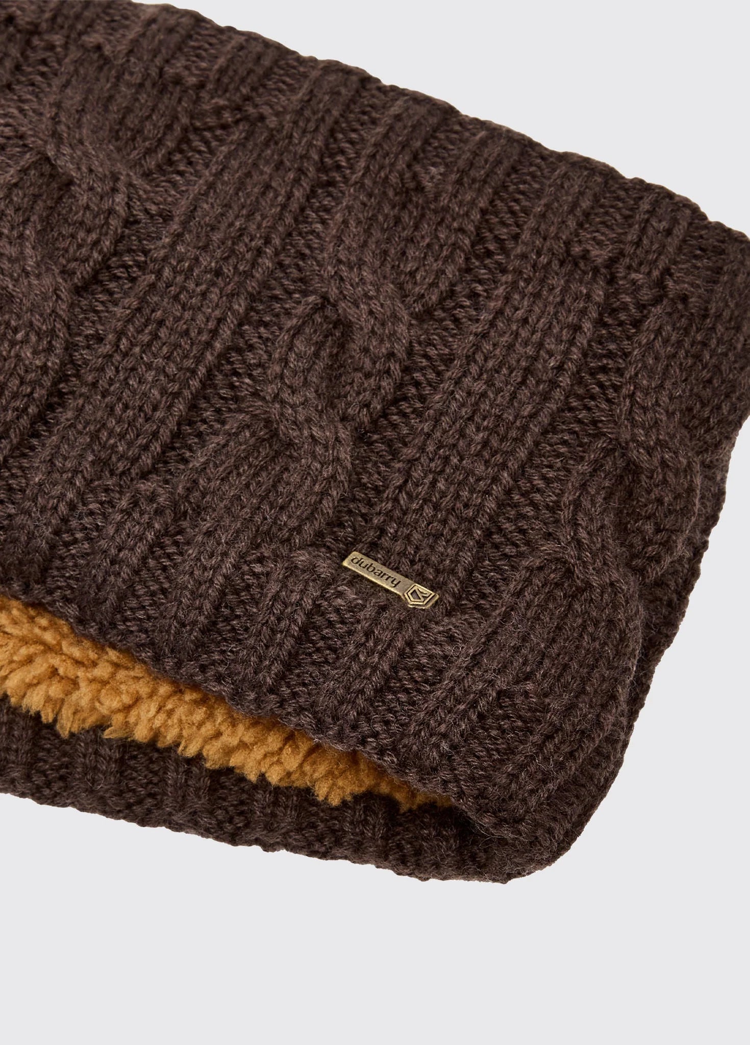 Brown knitted scarf with a brand logo on a light gray background