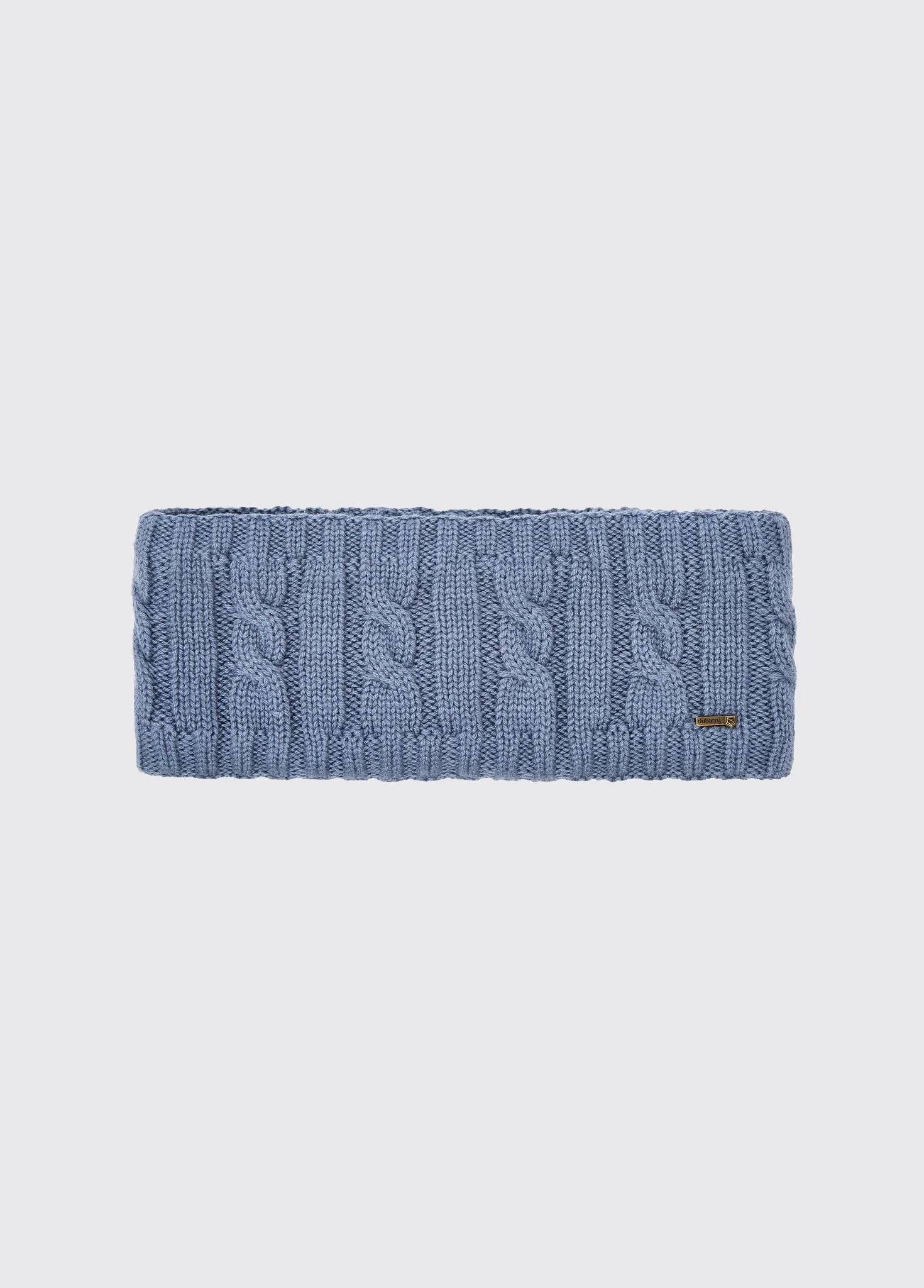 Blue knitted headband on a light gray background